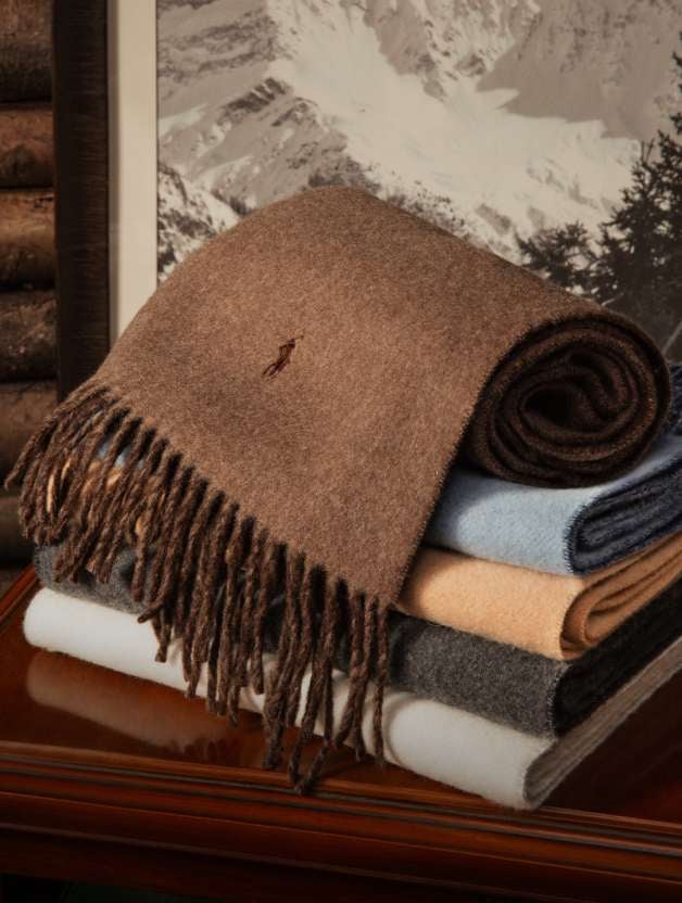 Garrett Cable-Knit Blanket on a brown chair