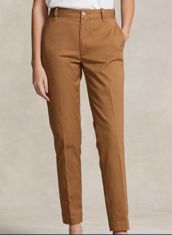 Photograph of woman in brown suede slim pants.