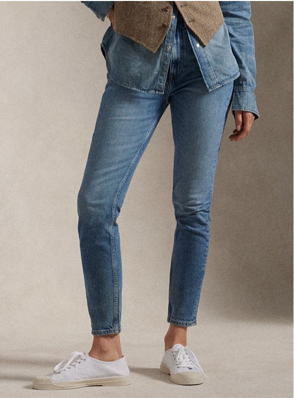 Photograph of woman in slim jeans.