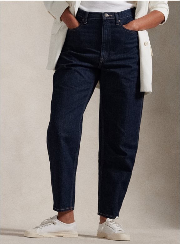 Photograph of woman in flared jeans.