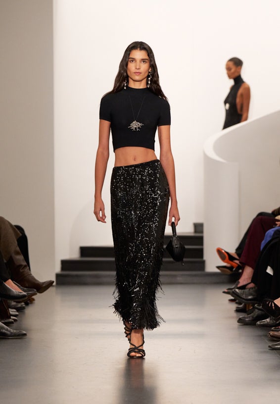 A look from Ralph Lauren’s Fall 2025 runway show shown on model.