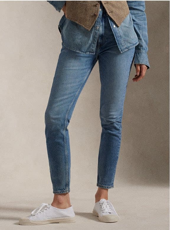 Photograph of woman in slim jeans.