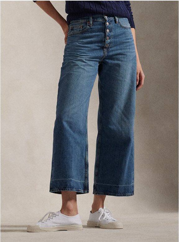 Photograph of woman in wide-leg jeans.