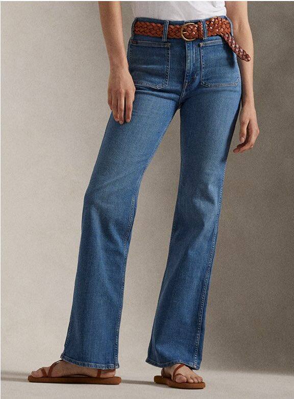 Photograph of woman in tapered jeans.