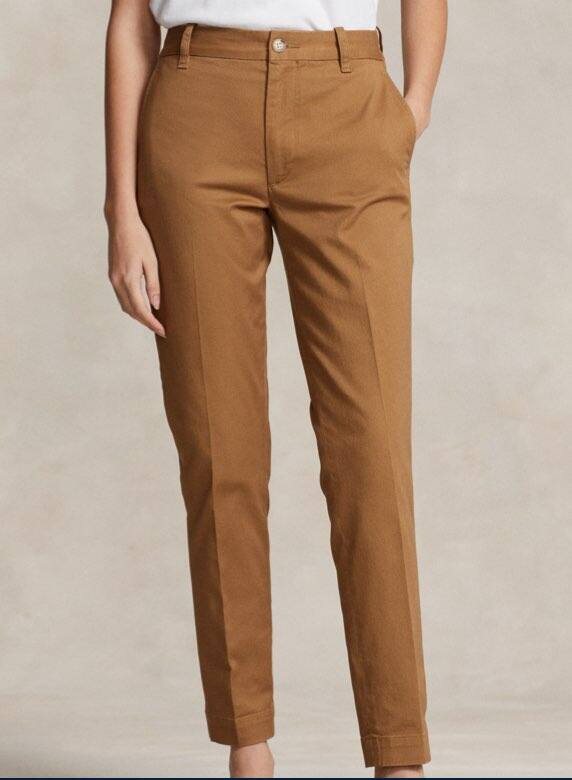 Photograph of woman in brown suede slim pants.