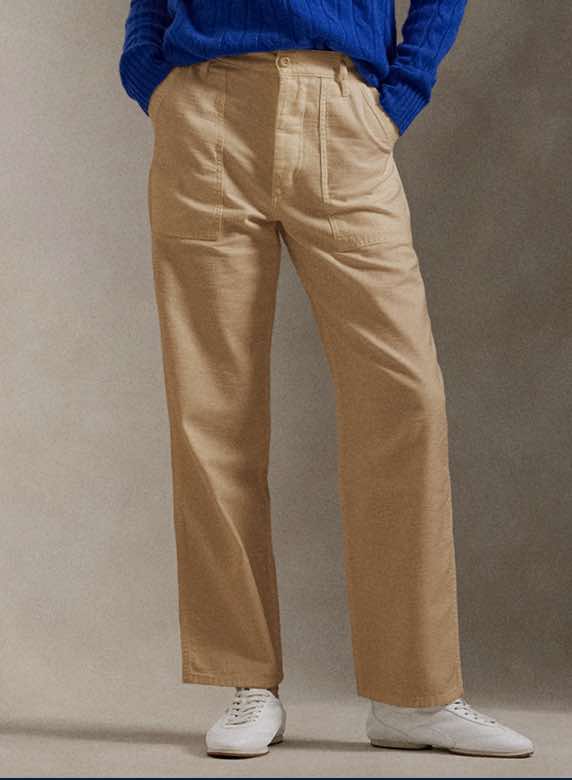 Photograph of woman in straight chino pants.